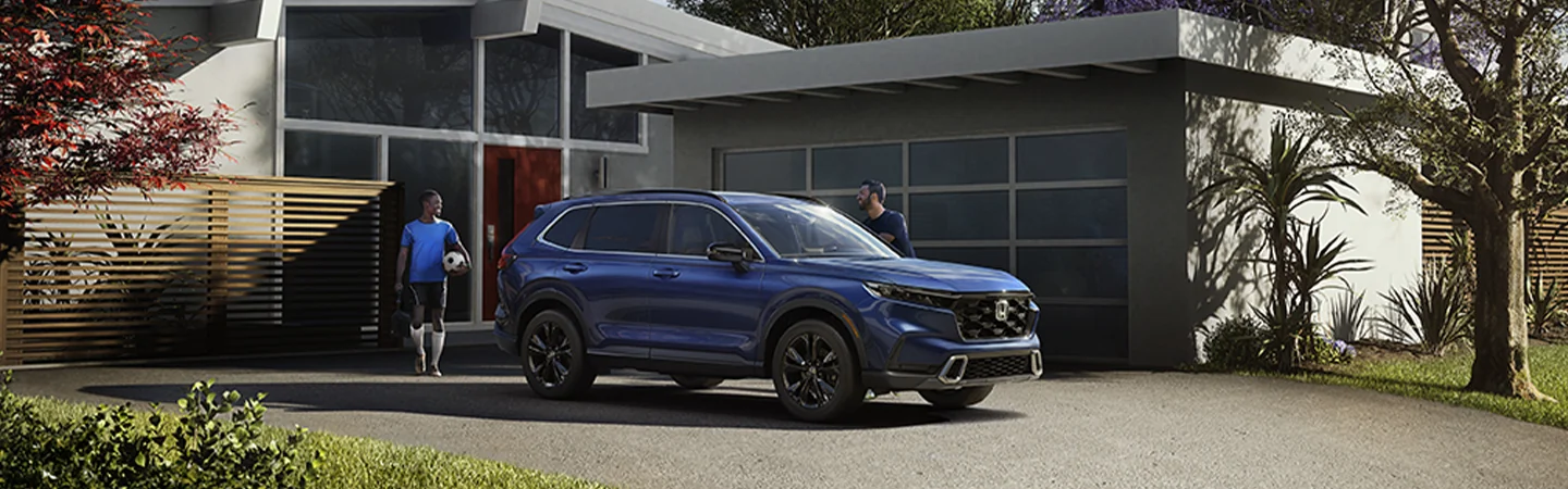 2025 Honda CR-V parked in front of a house