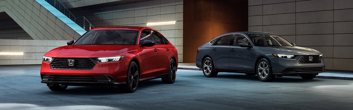 Front view of two 2025 Honda Accord sedans in a parking garage