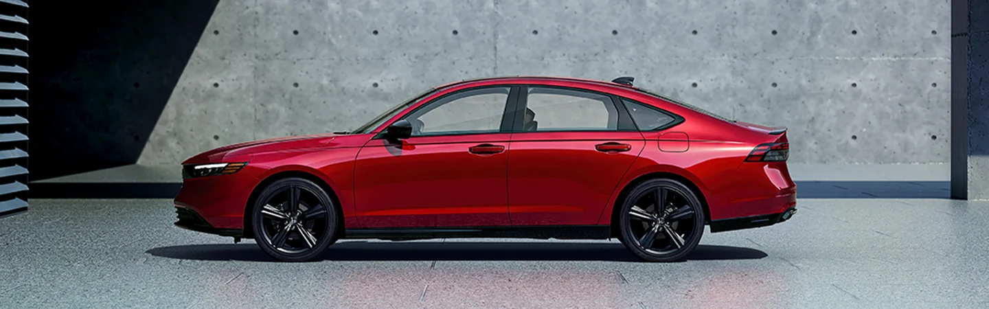 Side view of the 2025 Honda Accord parked in a parking garage