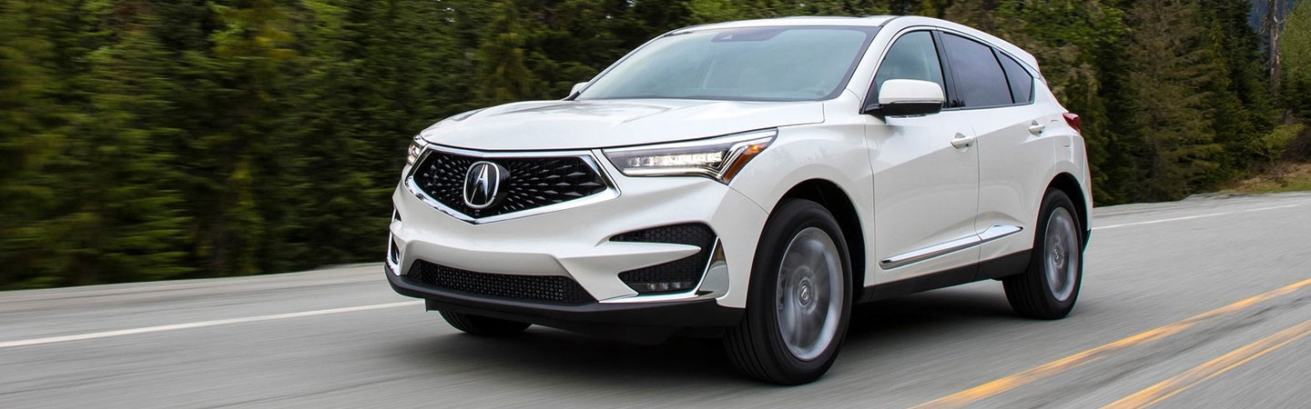 White Acura RDX in motion