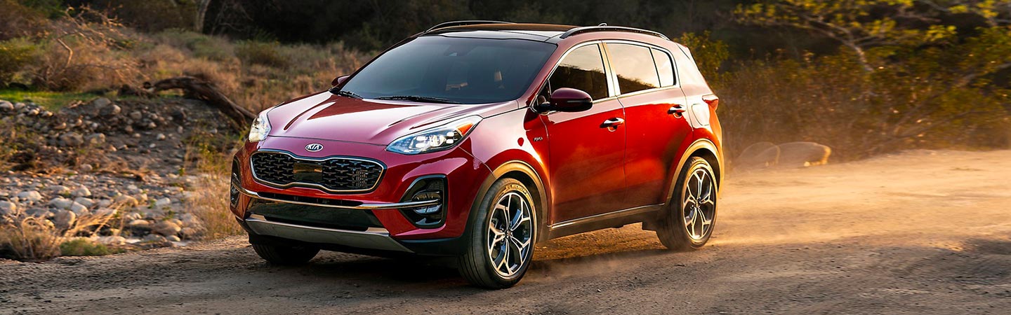 Red Kia Sportage in motion