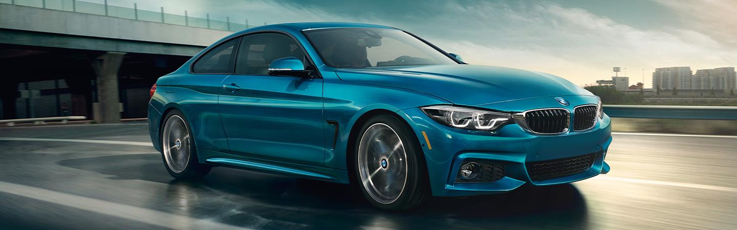 Side view of a blue 2020 BMW 4 Series