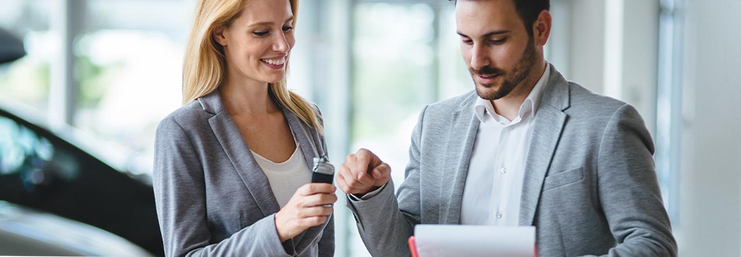 A man and woman discussing the options at Spitzer Volkswagen