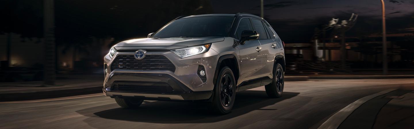 2020 Toyota RAV4 driving on a dark city street