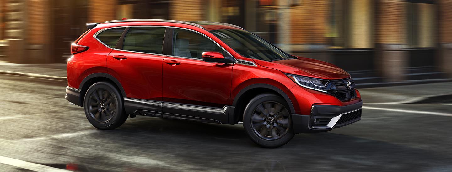 Side view of red 2020 Honda CR-V in motion