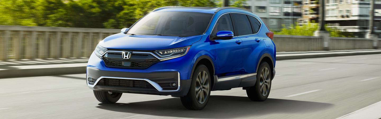 Front view of blue 2020 Honda CR-V driving on highway
