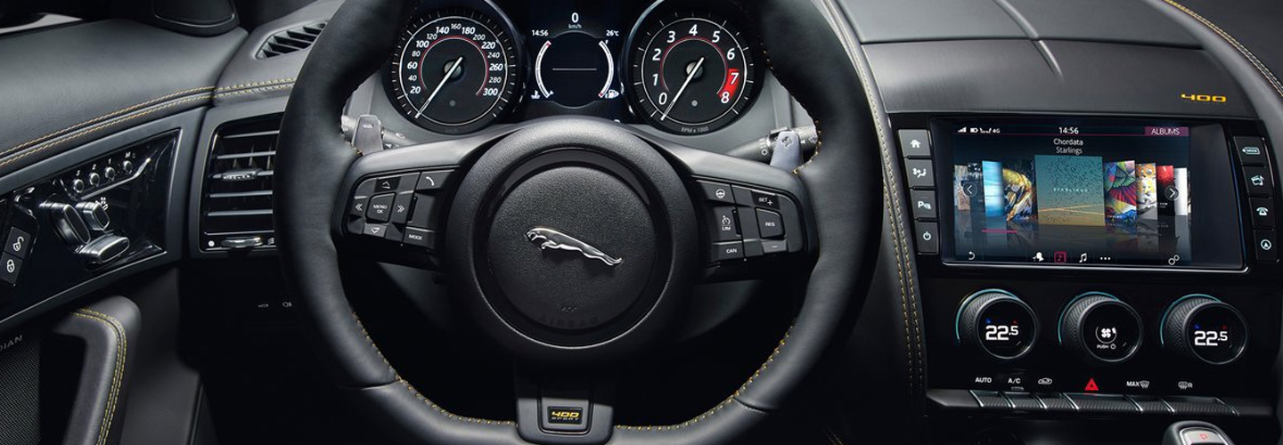 Steering wheel and infotainment system view of the Jaguar F-TYPE