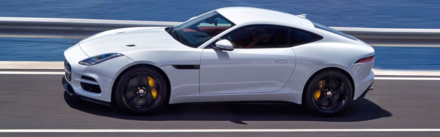 White Jaguar F-TYPE in motion