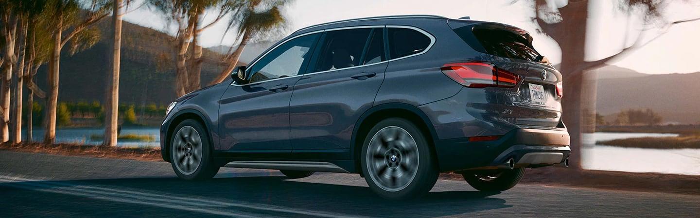 Dark grey 2021 BMW X1 Driving Lakeside 