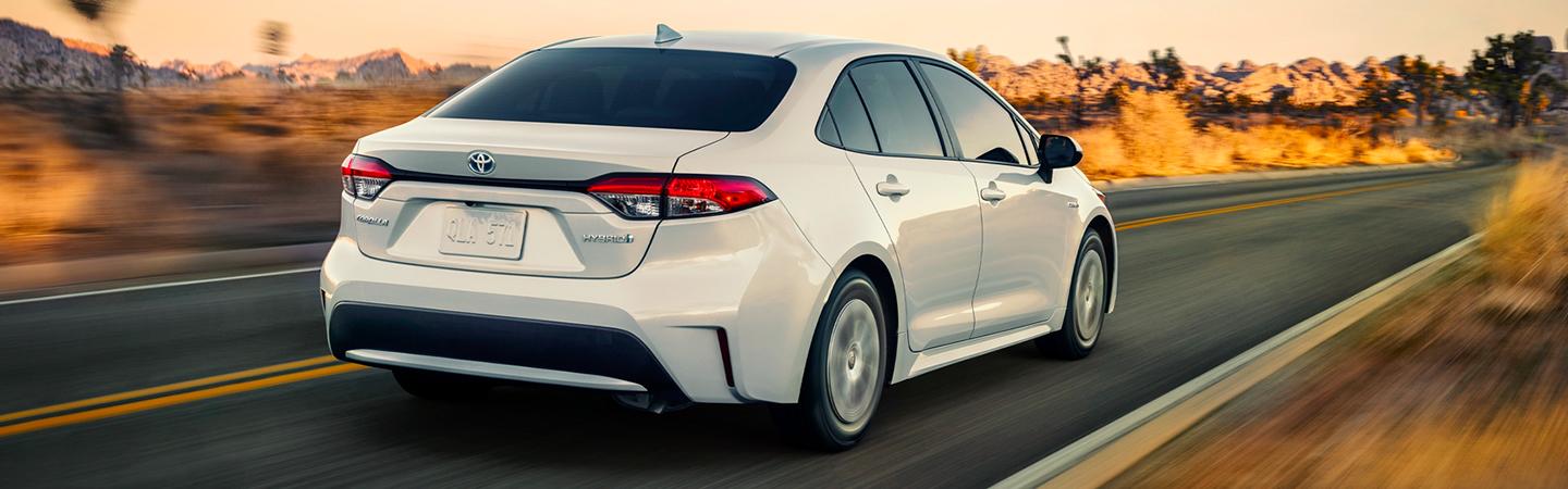 Rear View of White 2021 Toyota Corolla  In Motion