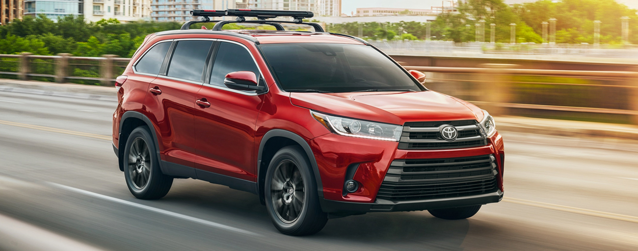2019 Toyota Highlander Exterior in Red - Driving on the road.