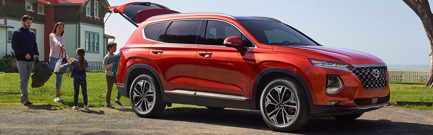 Orange Santa Fe and a family