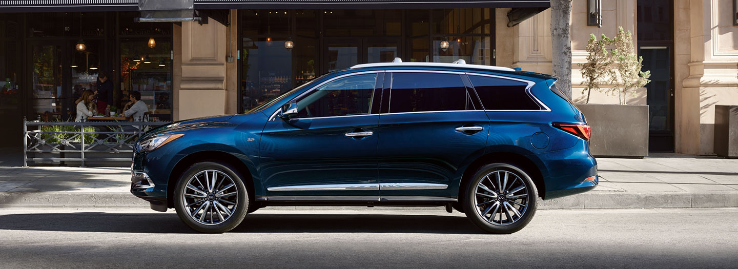 INFINITI QX60 drivers side view driving