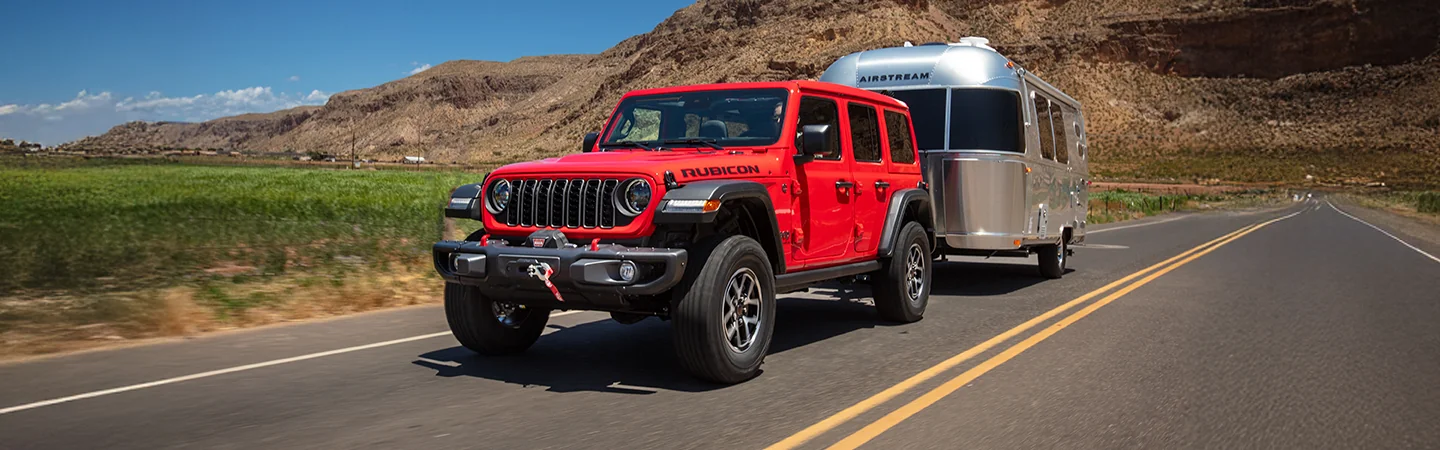 2025 Jeep Wrangler Rubicon towing an Airstream camper