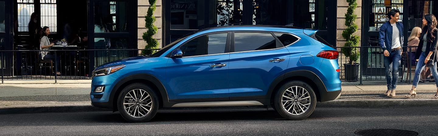 Driver’s side profile of blue 2020 Tucson