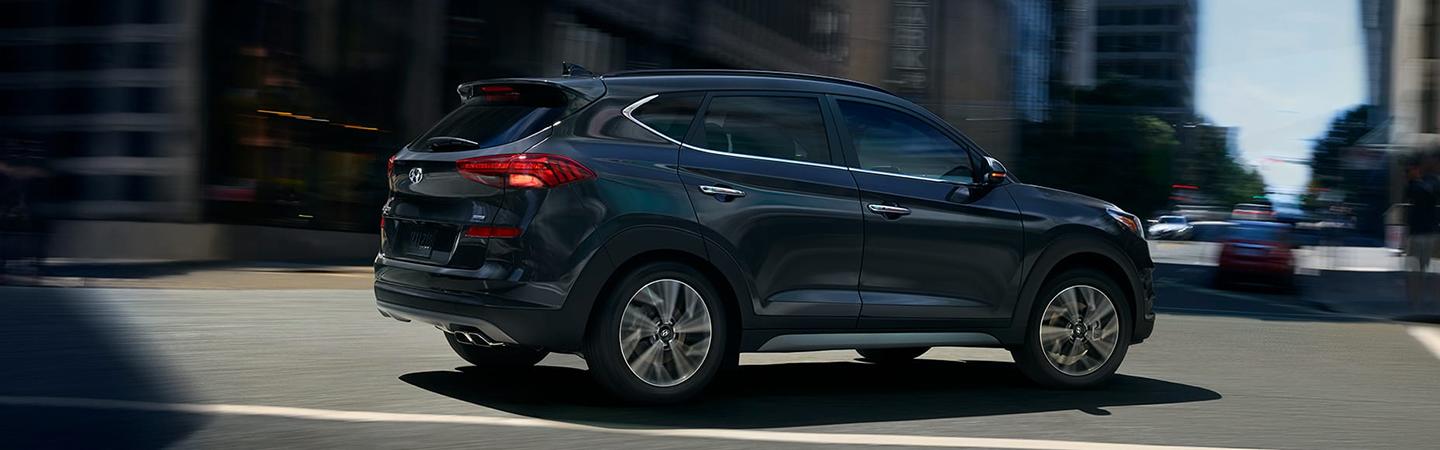 Gray Tucson driving in the city