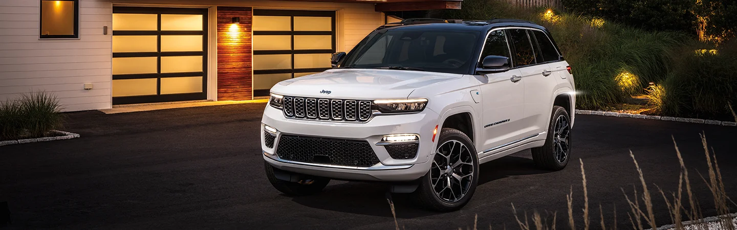 2025 Jeep Grand Cherokee parked in front of a house