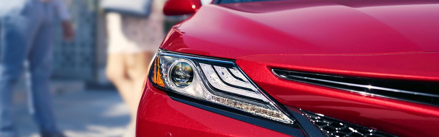 Upclose of Headlight of Red 2020 Toyota Camry 