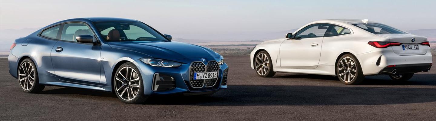 Blue and White 2021 BMW 4 Series Coupe Parked Side by Side