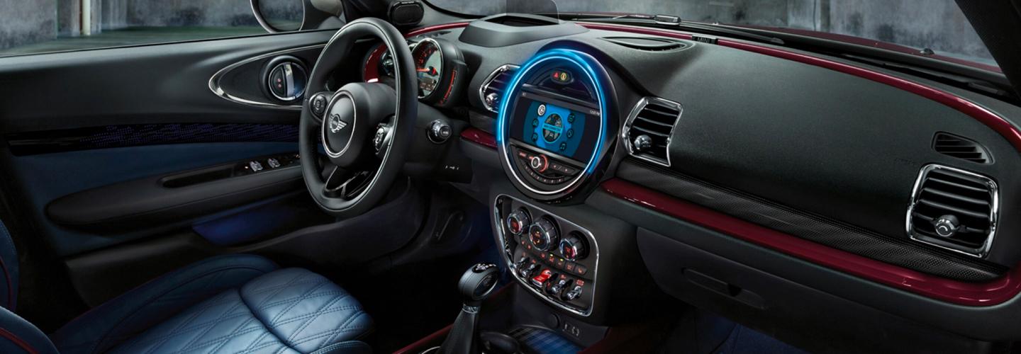 Passenger’s side view of a MINI Cooper Clubman’s steering wheel and dashboard