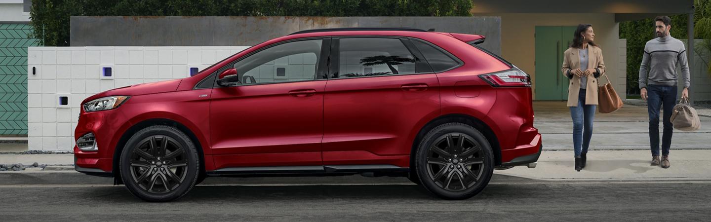 Side view of a red 2020 Ford Edge in motion