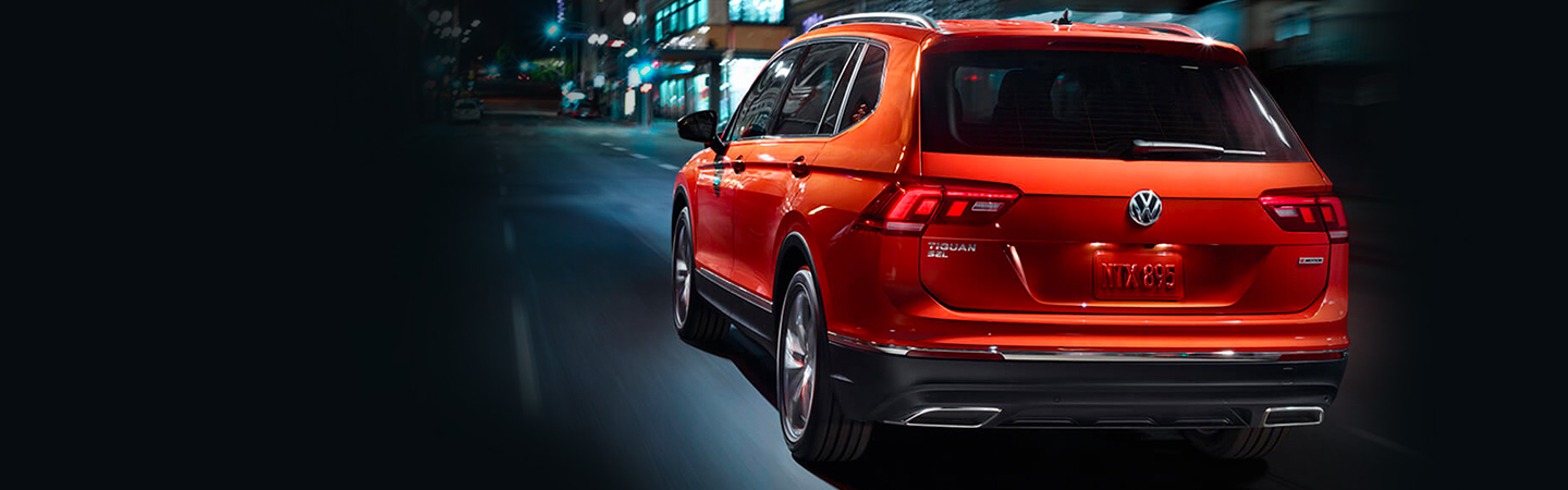 Rear of the 2019 Volkswagen Tiguan in motion available at Volkswagen of Gainesville
