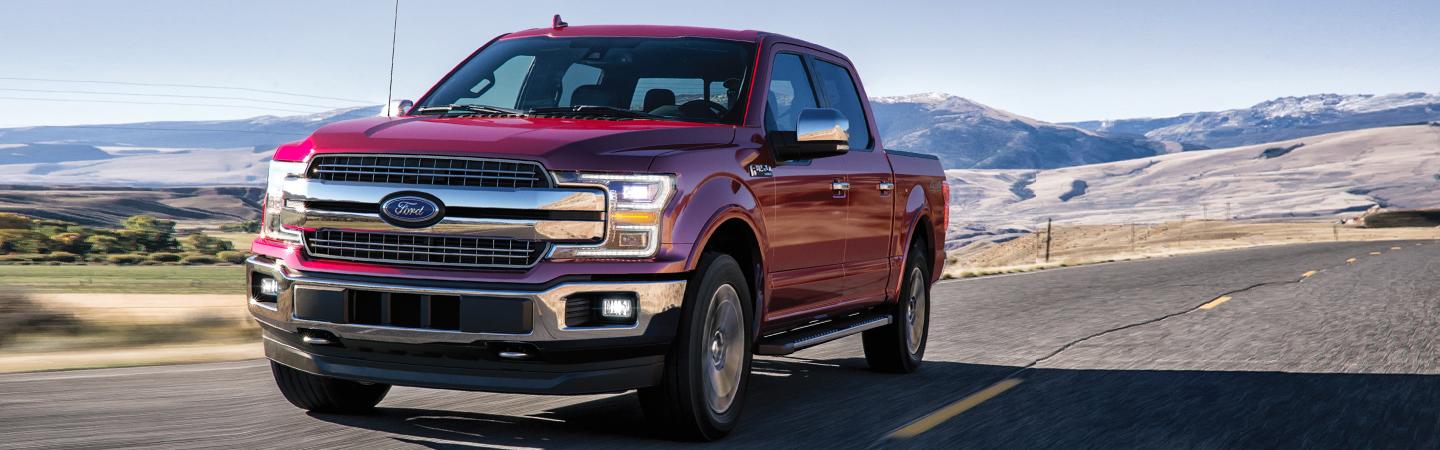 Front view of a red 2020 Ford F-150 in motion