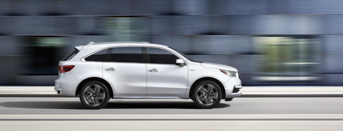 White Acura MDX in motion