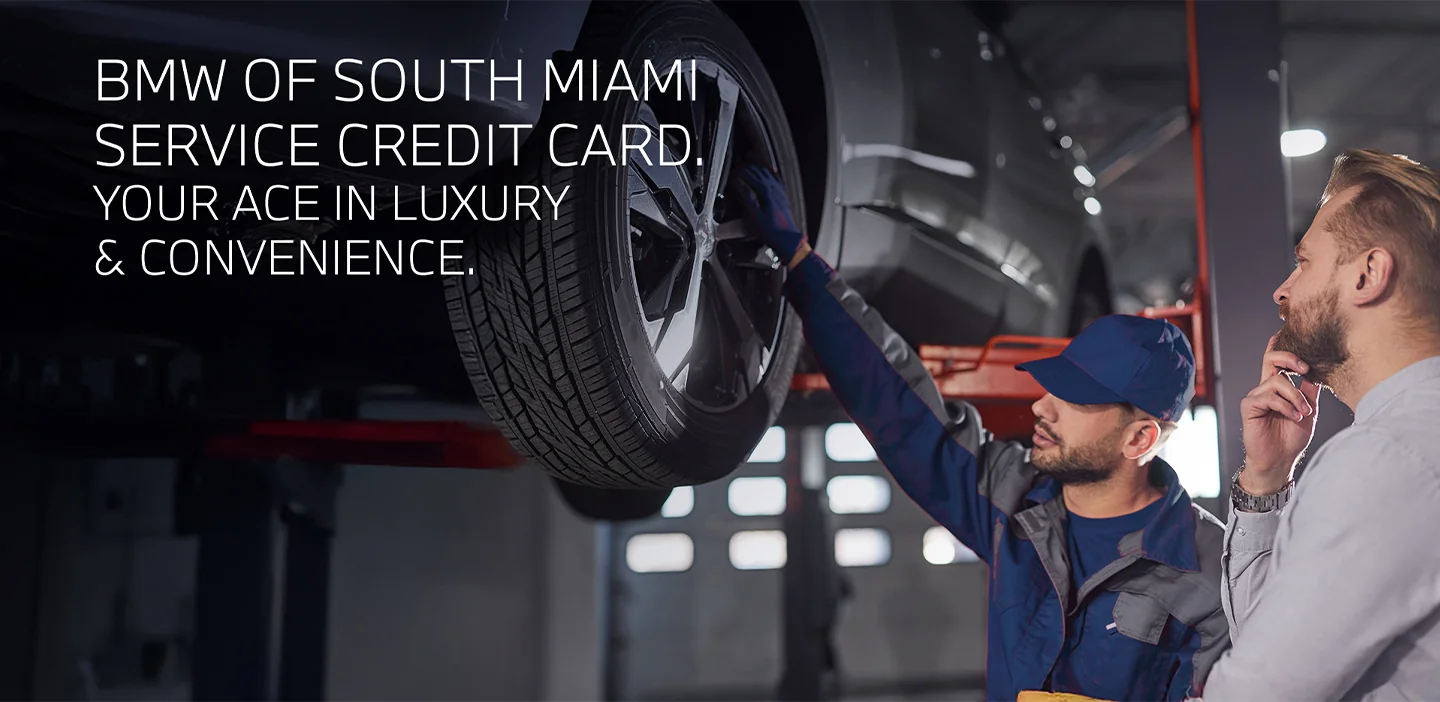 Service Credit Card with auto mechanic showing person repair details on car on a lift