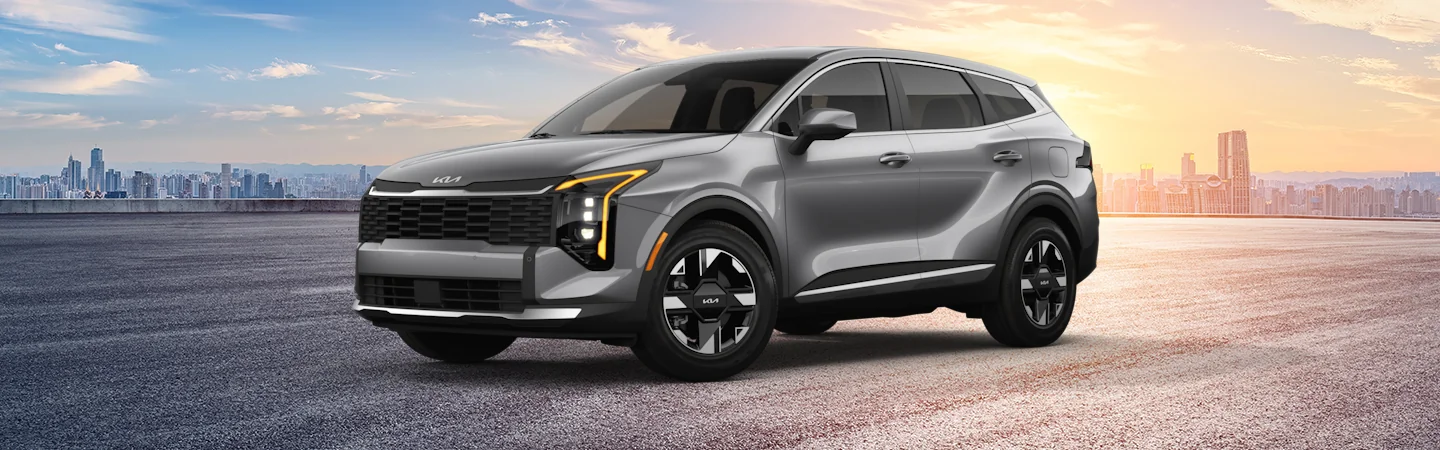 2026 Kia Sportage parked in front of a city skyline