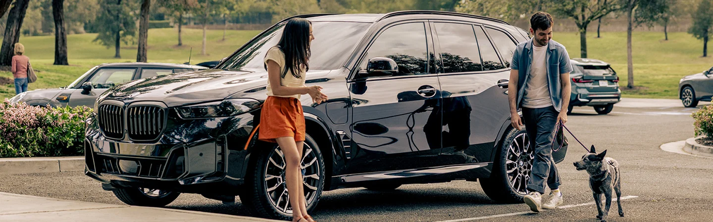 2026 BMW X5 near dog walkers