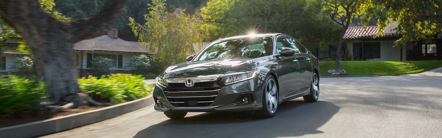 2021 Honda Accord driving in a neighborhood