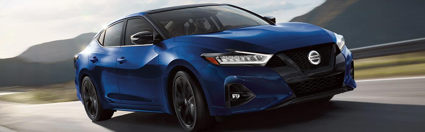 Blue 2021 Nissan Maxima in motion