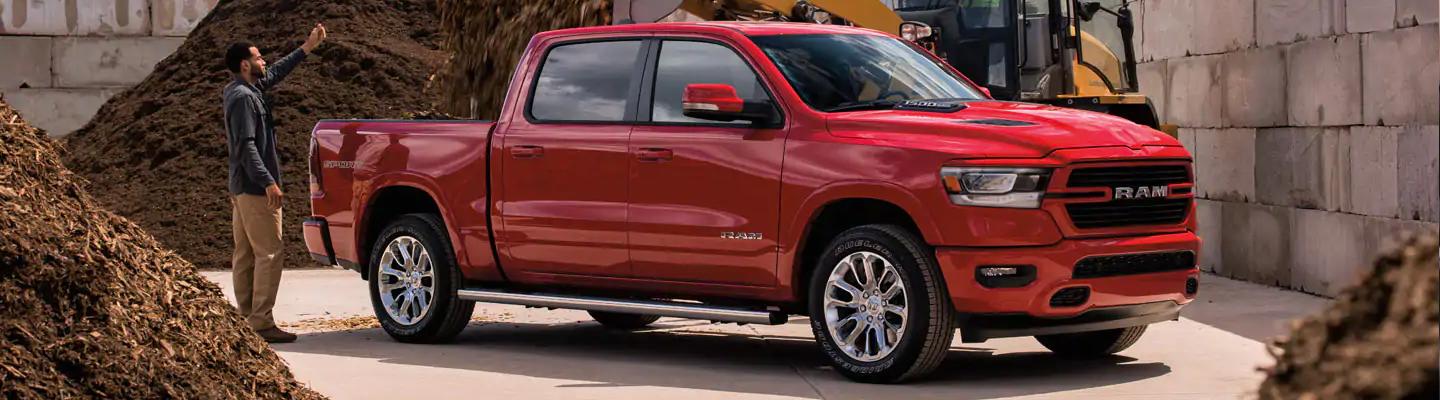 Side profile view of a red 2021 Ram 1500
