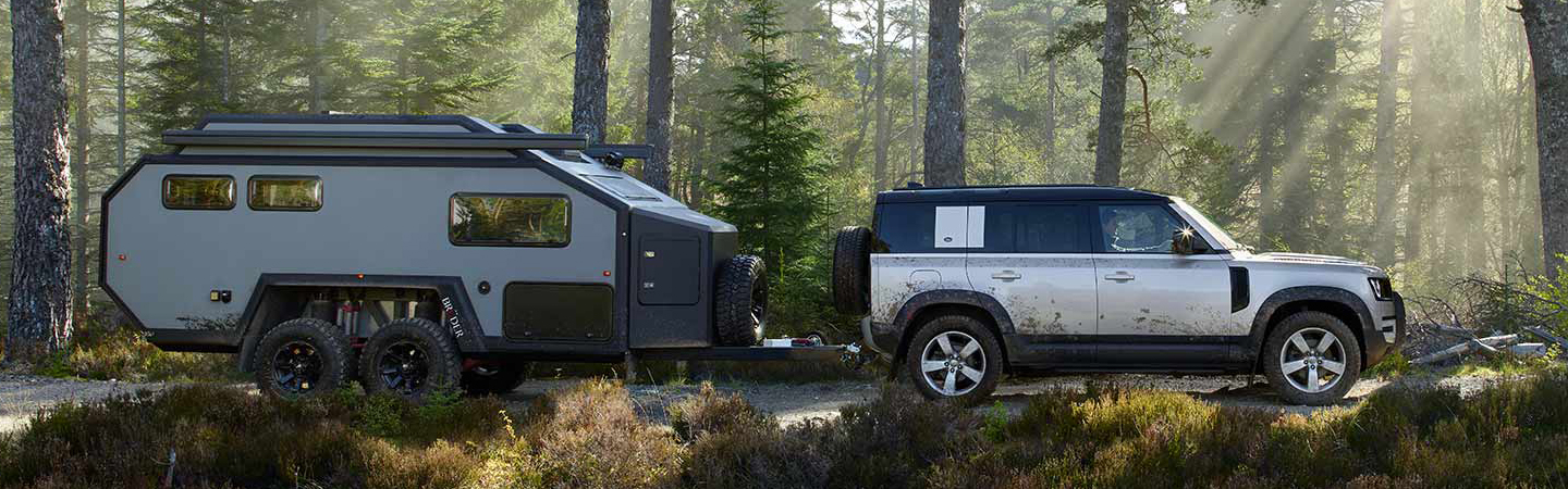 2024 Land Rover Defenders silver sideview 