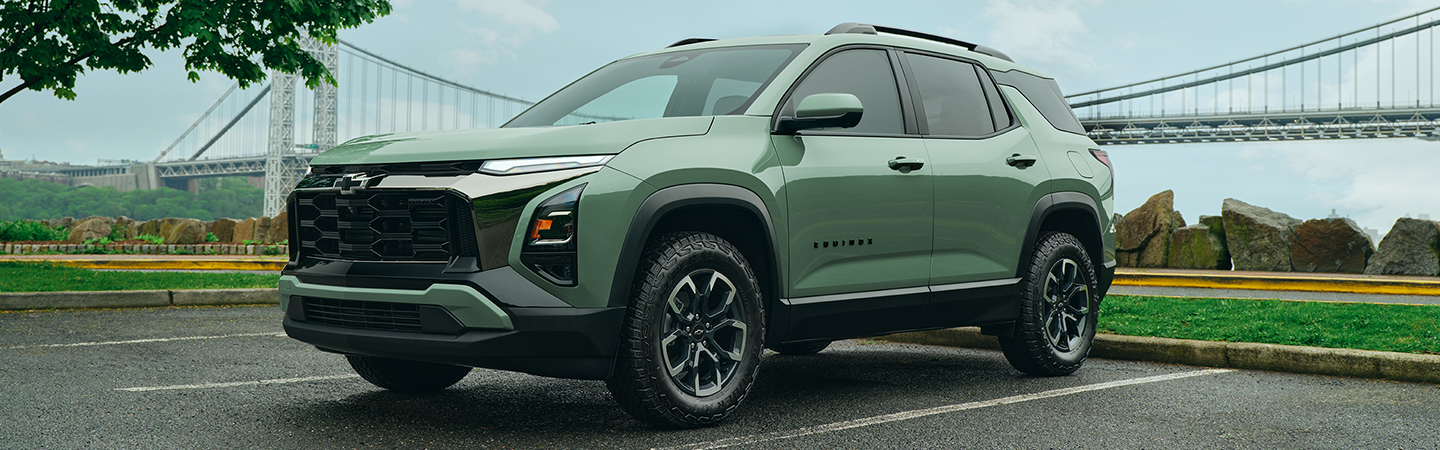 green Chevy Equinox on road