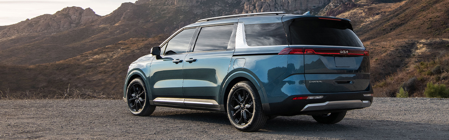 2024 Kia Carnival MSRP blue rareview 